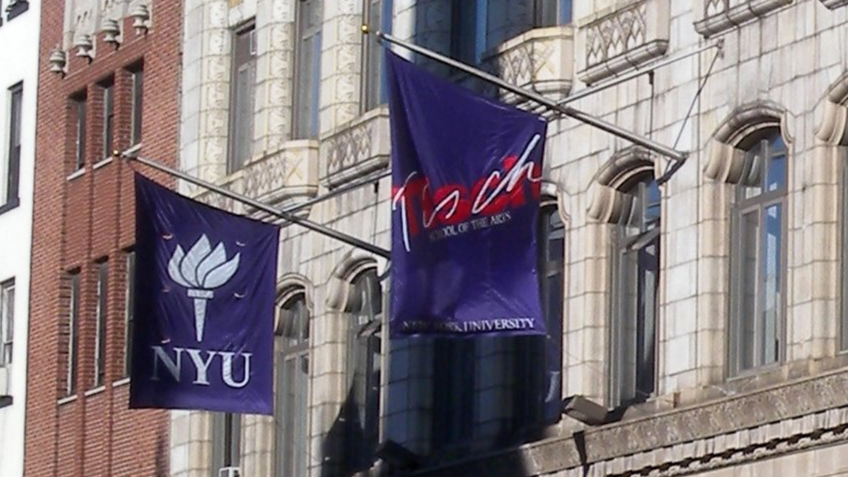 Tisch and NYU flags hanging outside an NYU building.